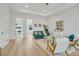 Light-filled living room showcasing mid-century modern furniture and hardwood floors at 3431 Palometa Dr, Hernando Beach, FL 34607