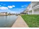 Concrete walkway along the canal offering water views at 3431 Palometa Dr, Hernando Beach, FL 34607