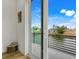 Bedroom with sliding glass doors opening to a waterfront balcony at 3431 Palometa Dr, Hernando Beach, FL 34607
