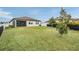 Large backyard with grassy area and privacy fence at 34432 Wynthorne Pl, Wesley Chapel, FL 33545