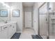 Bathroom with double vanity, shower and separate toilet at 34432 Wynthorne Pl, Wesley Chapel, FL 33545