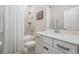 Bathroom with bathtub, toilet and white vanity at 34432 Wynthorne Pl, Wesley Chapel, FL 33545