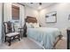 Charming bedroom with a comfy bed and a wooden chair at 34432 Wynthorne Pl, Wesley Chapel, FL 33545
