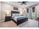 Spacious bedroom with wood bed frame and neutral decor at 34432 Wynthorne Pl, Wesley Chapel, FL 33545
