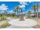 Attractive community entrance with a unique statue and landscaping at 34432 Wynthorne Pl, Wesley Chapel, FL 33545