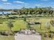 Dog park with fenced area, shaded seating, and waste disposal stations at 34432 Wynthorne Pl, Wesley Chapel, FL 33545
