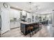 Modern kitchen with white cabinets, a large island, and stainless steel appliances at 34432 Wynthorne Pl, Wesley Chapel, FL 33545