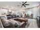 Open living space with comfortable seating and views into the kitchen area at 34432 Wynthorne Pl, Wesley Chapel, FL 33545