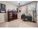 Home office with dark wood cabinet and desk at 34432 Wynthorne Pl, Wesley Chapel, FL 33545