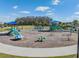 Modern playground with various play equipment at 34432 Wynthorne Pl, Wesley Chapel, FL 33545