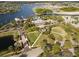 Aerial view of community clubhouse and lake at 406 Manns Harbor Dr, Apollo Beach, FL 33572