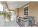 Relaxing balcony with comfortable seating and fire pit at 406 Manns Harbor Dr, Apollo Beach, FL 33572