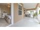 Covered balcony with outdoor seating and neighborhood views at 406 Manns Harbor Dr, Apollo Beach, FL 33572