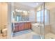 Elegant bathroom with double vanity, soaking tub, and separate shower at 406 Manns Harbor Dr, Apollo Beach, FL 33572
