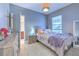 Cozy bedroom with a queen-size bed and en-suite bathroom at 406 Manns Harbor Dr, Apollo Beach, FL 33572