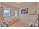 Bedroom with a full-size bed and large TV at 406 Manns Harbor Dr, Apollo Beach, FL 33572