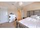 Spacious bedroom with a king-size bed and private access to the balcony at 406 Manns Harbor Dr, Apollo Beach, FL 33572