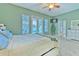 Primary bedroom with a king-size bed and access to the pool at 406 Manns Harbor Dr, Apollo Beach, FL 33572