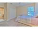 Comfortable bedroom with ensuite bathroom and natural light at 406 Manns Harbor Dr, Apollo Beach, FL 33572