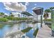 Private boat lift with wooden docks and calm water at 406 Manns Harbor Dr, Apollo Beach, FL 33572