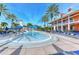 Community pool with a spray park and lounge chairs at 406 Manns Harbor Dr, Apollo Beach, FL 33572