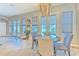 Kitchen dining area with a round table and access to the backyard at 406 Manns Harbor Dr, Apollo Beach, FL 33572