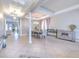 Elegant dining room with a chandelier and large windows, creating a bright and airy feel at 406 Manns Harbor Dr, Apollo Beach, FL 33572