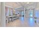 Bright dining room with a wood table and bench, showcasing natural light at 406 Manns Harbor Dr, Apollo Beach, FL 33572