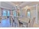 Spacious dining area with a rustic wooden table and stylish chandelier at 406 Manns Harbor Dr, Apollo Beach, FL 33572