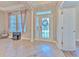 Bright and spacious entryway with tile flooring and a view into the office at 406 Manns Harbor Dr, Apollo Beach, FL 33572