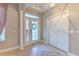 Bright and spacious entryway with tile flooring and a view into the office at 406 Manns Harbor Dr, Apollo Beach, FL 33572