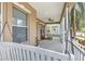 Relaxing front porch with a swing and seating area, perfect for enjoying the outdoors at 406 Manns Harbor Dr, Apollo Beach, FL 33572