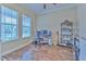 Home office with wood floors, large windows, and built-in shelving at 406 Manns Harbor Dr, Apollo Beach, FL 33572