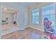 Bright home office features wood floors and a comfortable gaming chair at 406 Manns Harbor Dr, Apollo Beach, FL 33572