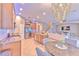 Open kitchen with stainless steel appliances and granite countertops at 406 Manns Harbor Dr, Apollo Beach, FL 33572