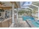 Relaxing pool area with covered patio and spa at 406 Manns Harbor Dr, Apollo Beach, FL 33572
