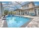 Inviting swimming pool with spacious patio at 406 Manns Harbor Dr, Apollo Beach, FL 33572