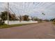 Residential street view showcasing a white fence at 4317 Overlook Ne Dr, St Petersburg, FL 33703