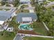 Aerial view of home showcasing pool and lush landscaping at 5084 42Nd S St, St Petersburg, FL 33711