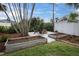 Landscaped backyard with raised garden beds and fire pit at 5084 42Nd S St, St Petersburg, FL 33711