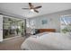 Main bedroom with king bed, access to patio, and built-in workspace at 5084 42Nd S St, St Petersburg, FL 33711