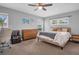 Spacious bedroom with a king-size bed, dresser, and office area at 5084 42Nd S St, St Petersburg, FL 33711