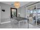 Bright dining room features a wood table with four chairs and access to the patio at 5084 42Nd S St, St Petersburg, FL 33711