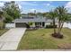 Charming ranch home with landscaped yard and attached garage at 5084 42Nd S St, St Petersburg, FL 33711