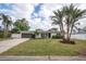 Updated ranch home with white exterior and palm trees at 5084 42Nd S St, St Petersburg, FL 33711
