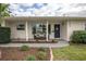 Renovated ranch home with a welcoming front porch and landscaping at 5084 42Nd S St, St Petersburg, FL 33711