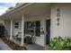 Updated home exterior featuring a charming front porch with seating at 5084 42Nd S St, St Petersburg, FL 33711