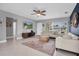 Living room with sectional sofa, large TV, and plenty of natural light at 5084 42Nd S St, St Petersburg, FL 33711