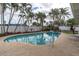 Inviting kidney-shaped pool surrounded by lush landscaping at 5084 42Nd S St, St Petersburg, FL 33711