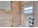 Walk-in shower with glass enclosure and neutral tile at 5084 42Nd S St, St Petersburg, FL 33711